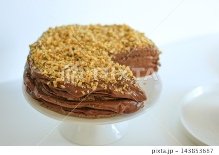 Homemade chocolate cake with nuts served on a plate close up 143853687