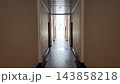 Symmetric Building Corridor Leading to Bright Outdoor Light    143858218