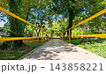Low Angle View of Outdoor Park Path with Yellow Metal Railings    143858221
