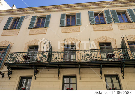 Facade of old building of the old town of Ajaccio, Corsica. Ajaccio is the capital and largest city of Corsica island, a French commune Facade of old building of the old town of Ajaccio, Corsica. Ajaccio is the capital and largest city of Corsica island, a French commune 143860588