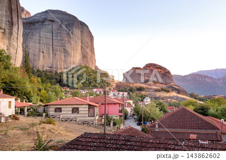 Kastraki Meteora Greece village houses under rock cliff in the evening Kastraki Meteora Greece village houses under rock cliff in the evening 143862602