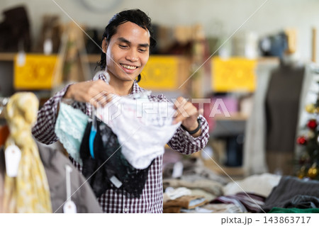 In chain shop, Indonesian man choose ladys lingerie panties, X mas shopping In chain shop, Indonesian man choose ladys lingerie panties, X mas shopping 143863717
