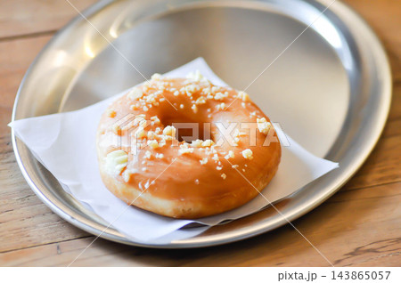 caramel donut or nut donut or caramel doughnut with crumble and cheese topping caramel donut or nut donut or caramel doughnut with crumble and cheese topping 143865057
