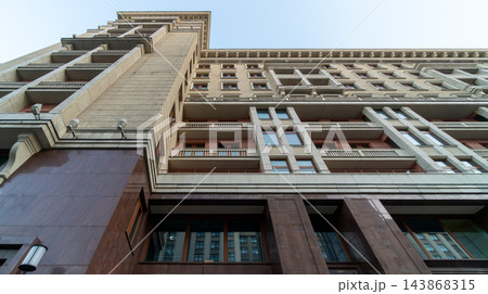 Low Angle View Of Classical Urban Building Facade With Repeating Windows And Balconies In City Low Angle View Of Classical Urban Building Facade With Repeating Windows And Balconies In City 143868315