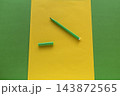 Green Marker on Yellow Paper With Green Background. 143872565