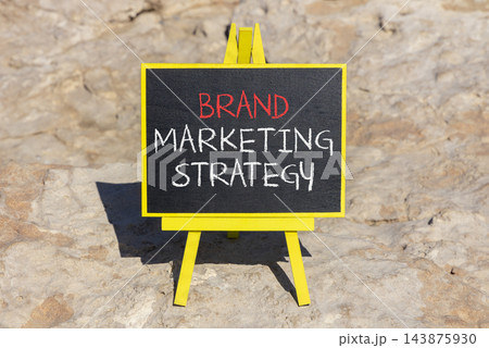 Brand marketing strategy words symbol. Concept words Brand marketing strategy on beautiful blackboard. Beautiful stone background. Business and brand marketing strategy concept. Copy space. 143875930