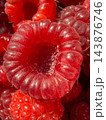 Harvest of sweet red ripe raspberries background 143876746
