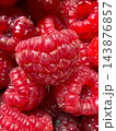 Fresh organic red ripe raspberries texture background 143876857