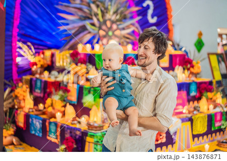 Father and infant enjoying a shared Mexican cultural outing. Father and infant enjoying a shared Mexican cultural outing. 143876871