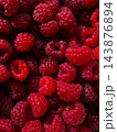 Bright red ripe raspberry berries texture background 143876894