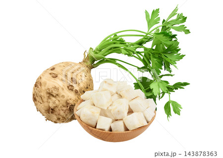 diced celery root in wooden bowl isolated on white background diced celery root in wooden bowl isolated on white background 143878363