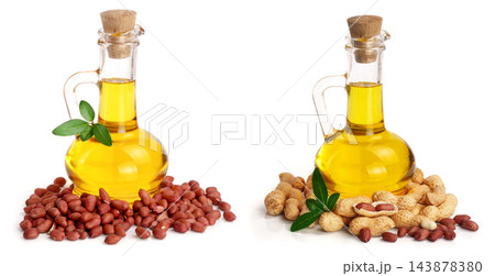 peanut oil in a glass bottle with peanuts peanut oil in a glass bottle with peanuts 143878380