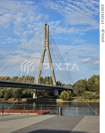 Warsaw, Poland - October 5, 2026: Swietokrzyski Bridge Pylon Against Textured Blue Sky in Warsaw Warsaw, Poland - October 5, 2026: Swietokrzyski Bridge Pylon Against Textured Blue Sky in Warsaw 143881869