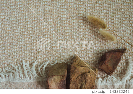 Minimalist product background with natural stones and dried grass  143883242