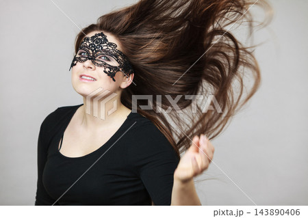Mysterious woman wearing lace mask 143890406
