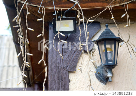 Set of decorative street lighting.String lights,vintage lantern,floodlights. Set of decorative street lighting.String lights,vintage lantern,floodlights. 143891238
