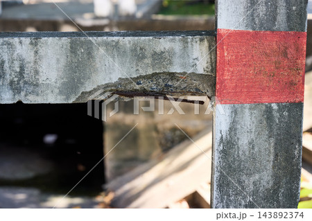 Exposed Rusty Rebar in Damaged Coastal Concrete Exposed Rusty Rebar in Damaged Coastal Concrete 143892374