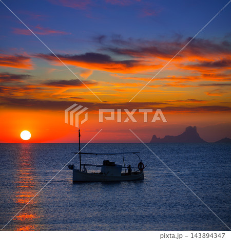 Ibiza sunset Es Vedra view and fisherboat formentera 143894347