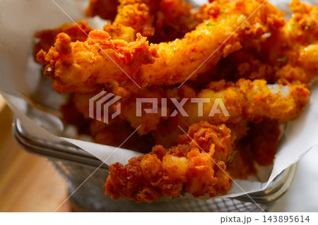 Fried breaded squid and curry sauce and lime Fried breaded squid and curry sauce and lime 143895614