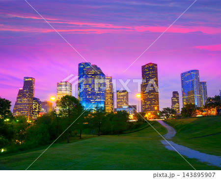 Houston Texas modern skyline at sunset twilight from park Houston Texas modern skyline at sunset twilight from park 143895907