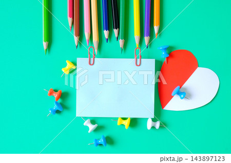 Color pencils with sticky paper and push pins on background. Color pencils with sticky paper and push pins on background. 143897123