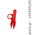 Red plastic thread nippers tailors scissors isolated on plain white background close up  143899226