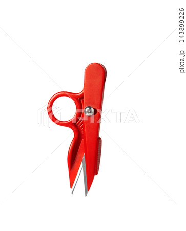 Red plastic thread nippers tailors scissors isolated on plain white background close up  143899226