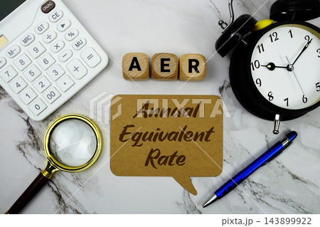 AER Annual Equivalent Rate text with calculator, magnifying glass and alarm clock on marble background AER Annual Equivalent Rate text with calculator, magnifying glass and alarm clock on marble background 143899922