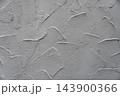 Gray plaster wall texture with troweled swirls for architectural background 143900366