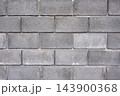 Concrete block wall forms an industrial background texture for construction and architecture 143900368