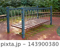 Playground bridge supports balance play in an empty outdoor park 143900380