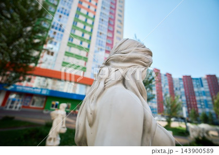 Close Up Shot of Carved Hair Texture on White Concrete Statue 143900589