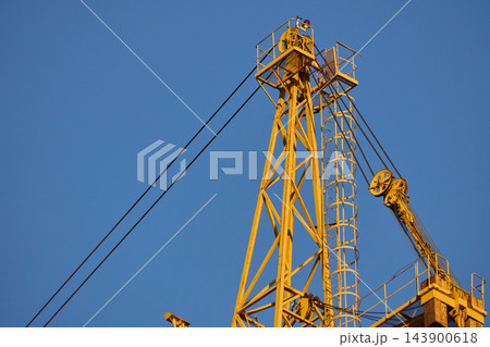 Top Section and Pulley System of Yellow Tower Crane Top Section and Pulley System of Yellow Tower Crane 143900618