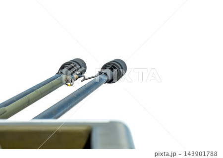 Twin naval gun barrels isolated against white background from low angle Twin naval gun barrels isolated against white background from low angle 143901788
