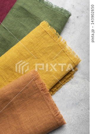 Close Up of Colorful Fringed Linen Napkins Stack Close Up of Colorful Fringed Linen Napkins Stack 143902650