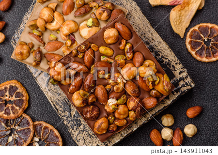 A bar of sugar free milk chocolate with pistachios, almonds, and hazelnuts. A milk chocolate bar A bar of sugar free milk chocolate with pistachios, almonds, and hazelnuts. A milk chocolate bar 143911043