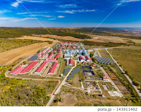 Aerial view of a solar powered industrial complex among fields and scrubland in rural Texas during the day 143911402