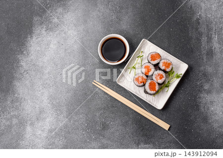 Sushi roll with tuna, rice, and cream cheese, served with soy sauce, wasabi, and ginger. Tuna roll Sushi roll with tuna, rice, and cream cheese, served with soy sauce, wasabi, and ginger. Tuna roll 143912094
