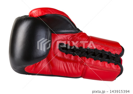 Red and black professional boxing glove with lace up closure isolated on white 143915394