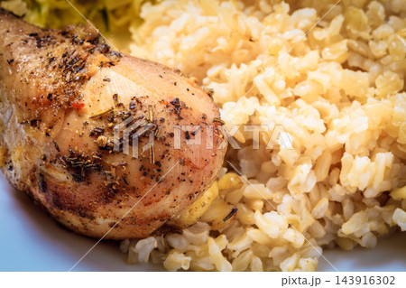 Chicken meat drumstick with rice and salad 143916302