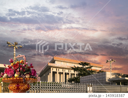Mausoleum of Mao Zedong and huge flower basket (against the sunset), Tiananmen Square, Beijing, China Mausoleum of Mao Zedong and huge flower basket (against the sunset), Tiananmen Square, Beijing, China 143918387