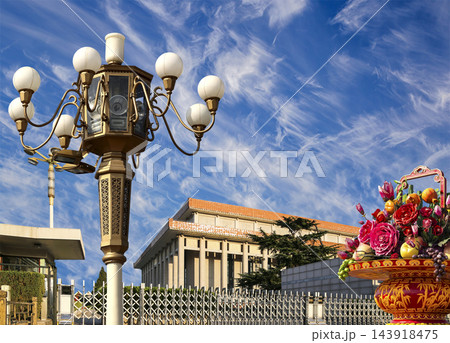 Mausoleum of Mao Zedong with street lamp and huge flower basket (against the background of a beautiful sky with clouds), Tiananmen Square, Beijing, China 143918475