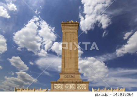 Monument to the People's Heroes at the Tiananmen Square (against the sky with clouds), Beijing, China. Translation of the inscription on the monument: Eternal glory to the people's heroes... 143919064