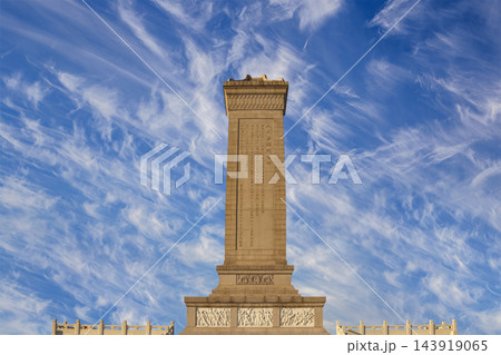 Monument to the People's Heroes at the Tiananmen Square (against the sky with clouds), Beijing, China. Translation of the inscription on the monument: Eternal glory to the people's heroes... 143919065