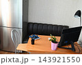 Indoor desk with computer and supplies 143921550