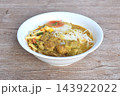 rice noodles in coconut milk curry soup with beef meat topping slice creamy     boiled egg yolk halal food on bowl 143922022