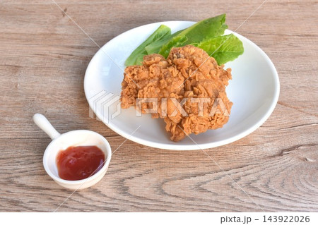 crispy fried chicken tight with fresh cos lettuce salad on plate dipping ketchup 143922026