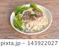 steamed spaghetti topping slice ham pork with dressing white truffle mushroom cream sauce with fresh cos lettuce salad on plate 143922027