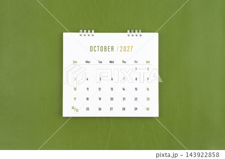 October 2027 Monthly desk calendar on green leather background. Flat lay. 143922858