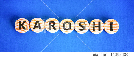 Karoshi word symbol. Concept word Karoshi on beautiful wooden circles. Beautiful blue background. Business medical Karoshi word concept. Copy space. 143923003